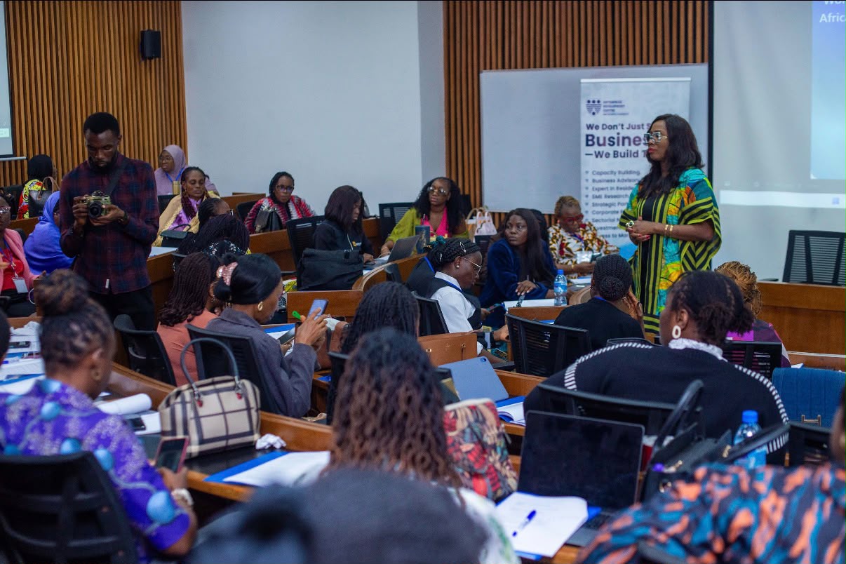 An auditorium of women at a workshop